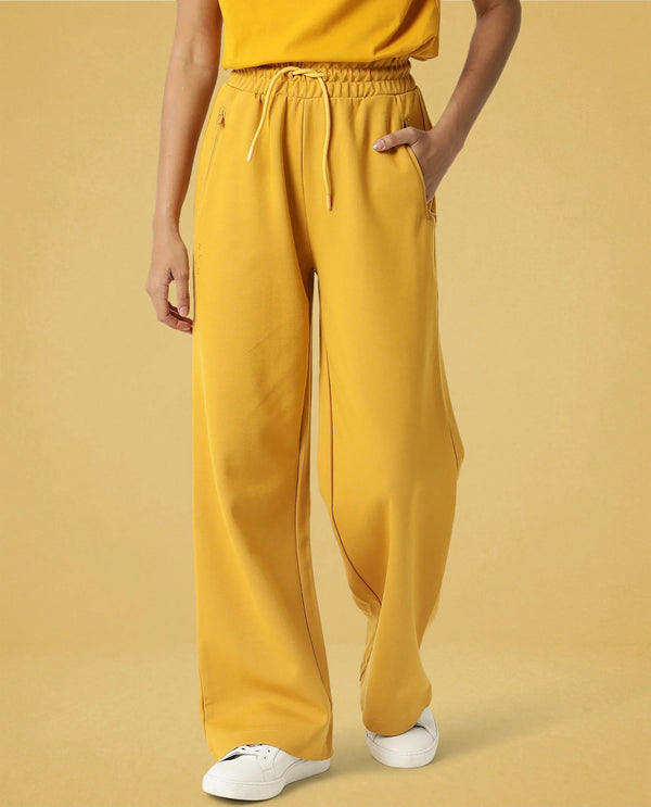 Rareism Women Capsule Mustard Cotton Blend Fabric Relaxed Fit Solid Mid Rise Ankle Length Track Pant