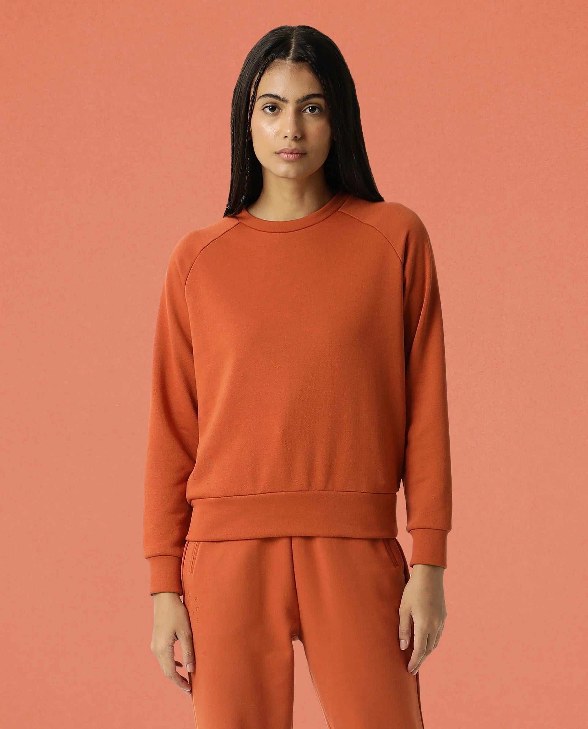 Rareism Women Cax Orange Cotton Blend Fabric Relaxed Fit Full Sleeves Solid Round Neck Sweatshirt