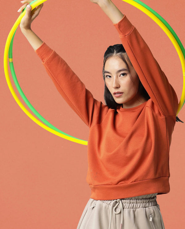 Rareism Women Cax Orange Cotton Blend Fabric Relaxed Fit Full Sleeves Solid Round Neck Sweatshirt