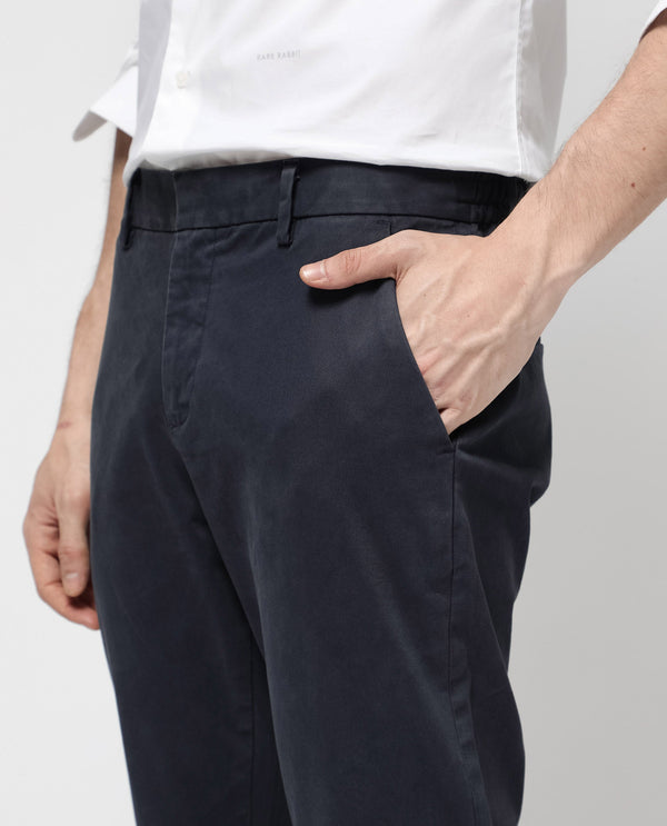 Rare Rabbit Mens Orany Navy Cotton Lycra Solid Mid Rise Overdyed Regular Fit Trouser