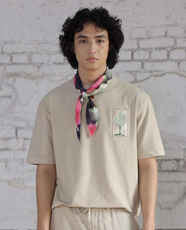 Rare Rabbit Men's Loopet Beige Cotton Lycra Fabric Half Sleeves Floral Print Pocket Detailing Oversized Fit Solid T-Shirt