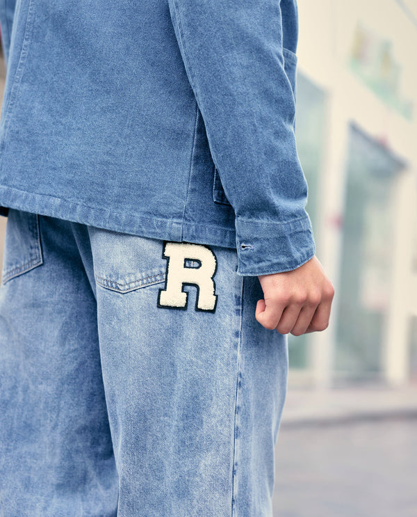 Rare Rabbit Men Riffin Light Blue Cotton Fabric Button And Zip Closure Baggy Fit Embroidered Logo Plain Jeans