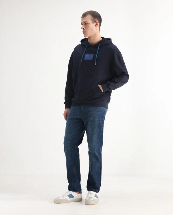 Rare Rabbit Men Axel Blue Cotton Blend Fabric Mid Rise Button and Zip Closure Mid Wash Plain Jeans