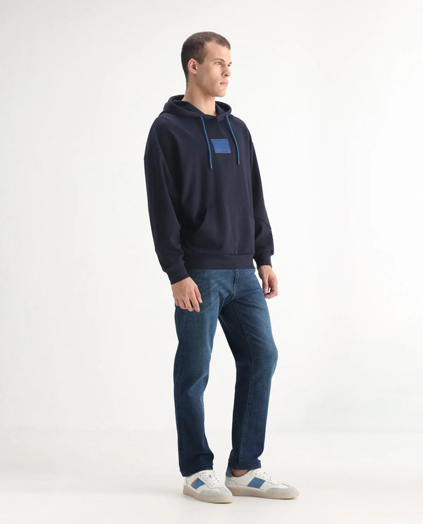 Rare Rabbit Men Axel Blue Cotton Blend Fabric Mid Rise Button and Zip Closure Mid Wash Plain Jeans