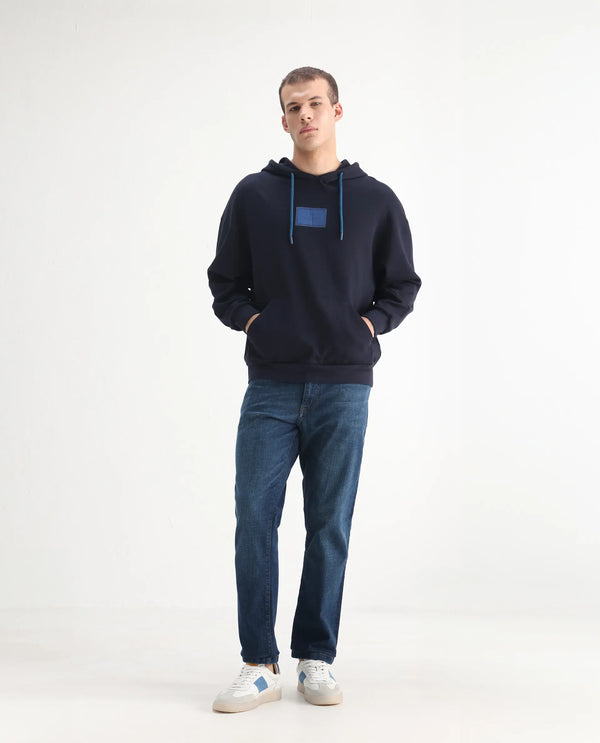 Rare Rabbit Men Axel Blue Cotton Blend Fabric Mid Rise Button and Zip Closure Mid Wash Plain Jeans