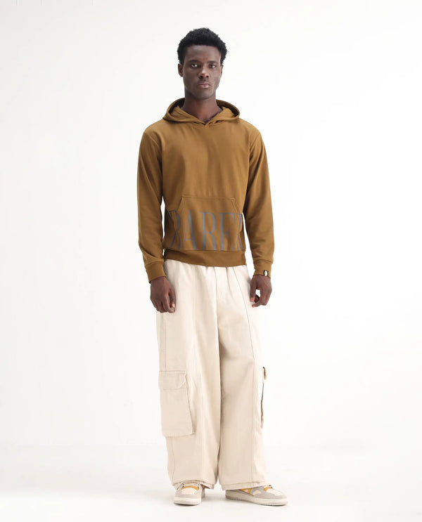 Rare Rabbit Men's Azort Beige Cotton Fabric Button And Zip Closure Baggy Fit Plain Jeans
