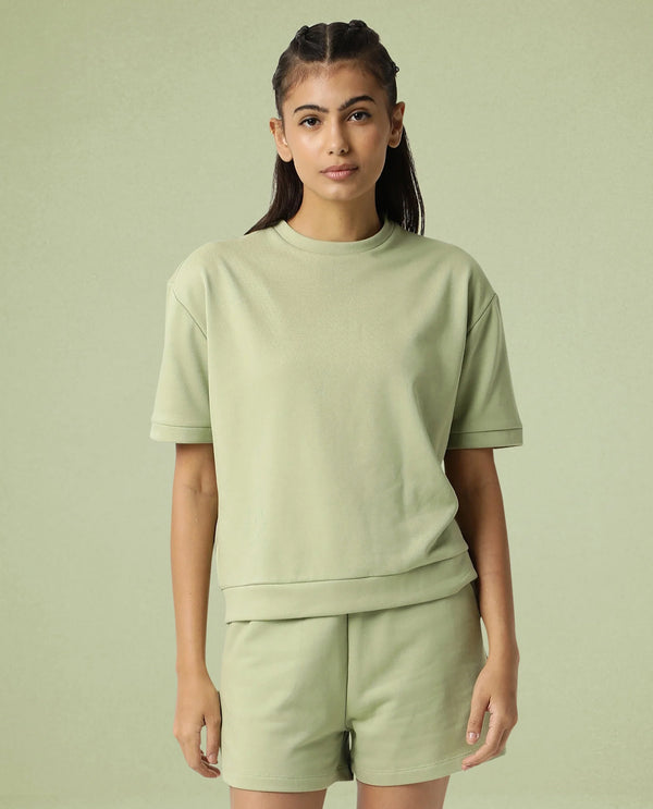 Rareism Women Coco Light Green Cotton Fabric Half Sleeves Relaxed Fit Solid Round Neck Sweat Tee