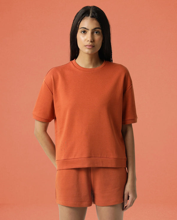 Rareism Women Coco Orange Cotton Fabric Half Sleeves Relaxed Fit Solid Round Neck Sweat Tee