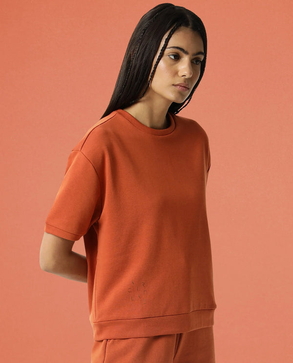 Rareism Women Coco Orange Cotton Fabric Half Sleeves Relaxed Fit Solid Round Neck Sweat Tee