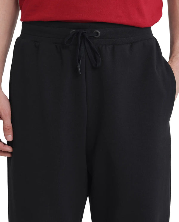 Rare Rabbit Men Dalton Black Cotton Elastane Fabric Baggy Fit Drawstring Closure Plain Knitted Trouser