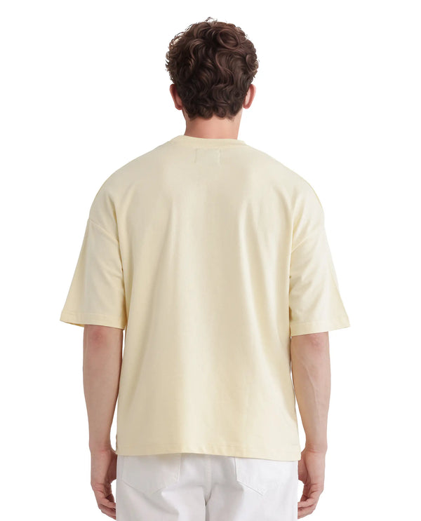 Rare Rabbit Men Fler Pastel Yellow Cotton Fabric Short Sleeve Crew Neck Oversized Fit Hd and Typography Print T-Shirt