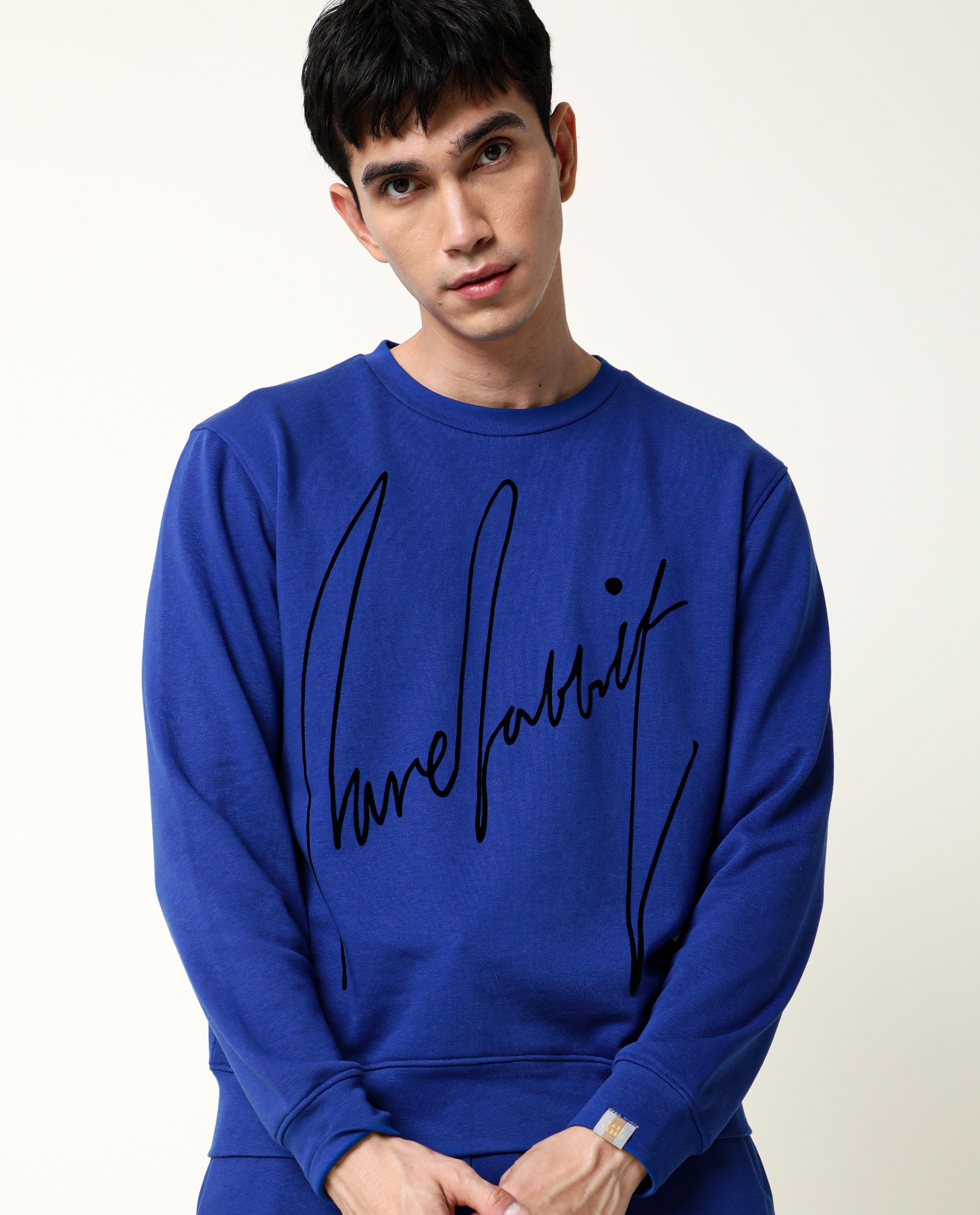 Rare Rabbit Men's Flocker Fluorescent Blue Cotton Fabric Full Sleeves Signature Branding Sweatshirt