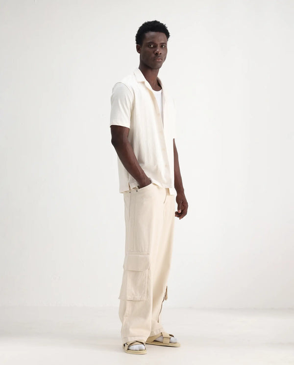 Rare Rabbit Men's Freks Beige Cotton Fabric Button And Zip Closure Baggy Fit Plain Jeans