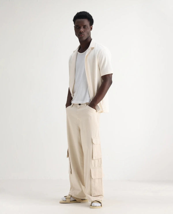 Rare Rabbit Men's Freks Beige Cotton Fabric Button And Zip Closure Baggy Fit Plain Jeans