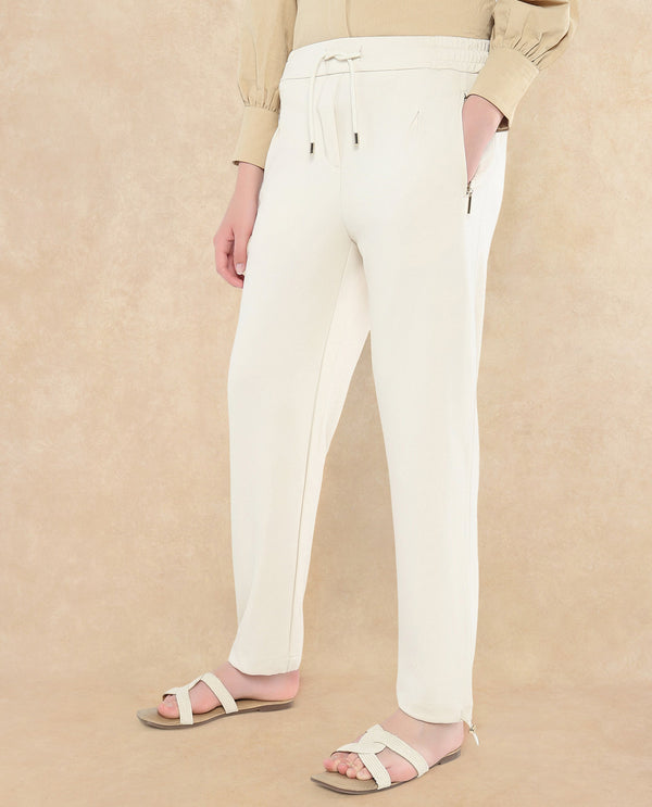 Rareism Women Gumushane Off White Modal Lycra Fabric Straight Fit Ankle Length Plain Track Pant
