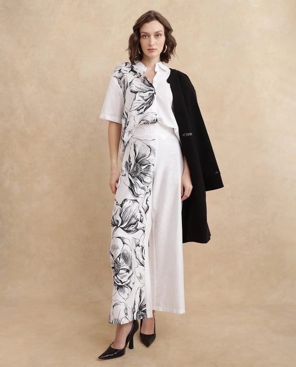 Rareism Women Neilsono White Cotton Satin Fabric Tie-Up Closure Flared Fit Ankle Length Floral Print Trouser