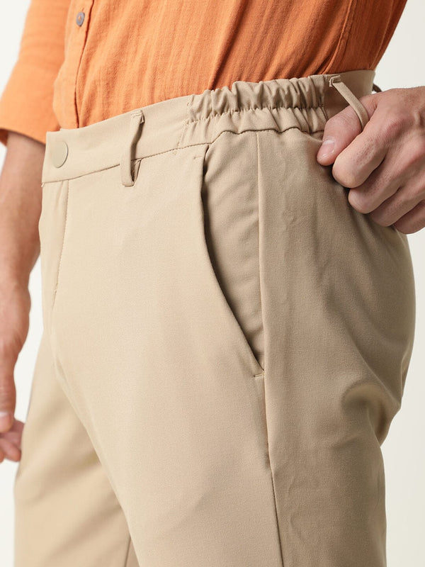 Rare Rabbit Men's Travel-1 Beige Solid Mid-Rise 4-Way Stretch Slim Fit Trouser