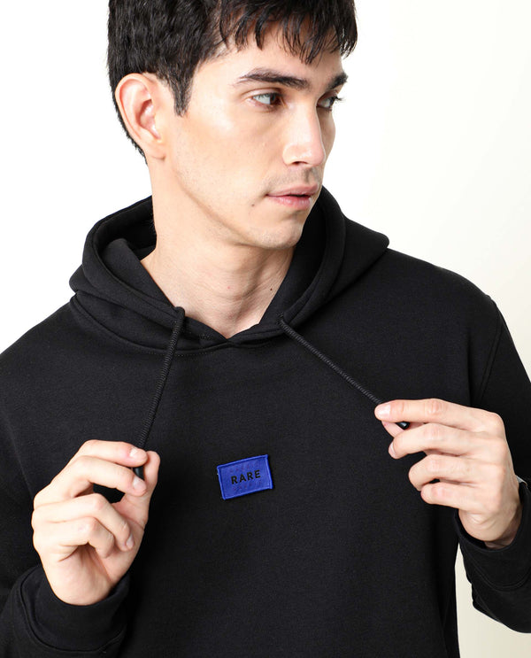 Rare Rabbit Men's Indo Black Cotton Polyester Fabric Full Sleeves Detachable Badge Hooded Sweatshirt
