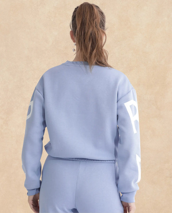 Rareism Articale Women Jonice Light Blue Poly Cotton Fabric Full Sleeves Crew Neck Regular Fit Graphic Print Cropped Sweatshirt