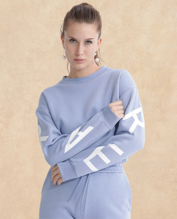 Rareism Articale Women Jonice Light Blue Poly Cotton Fabric Full Sleeves Crew Neck Regular Fit Graphic Print Cropped Sweatshirt