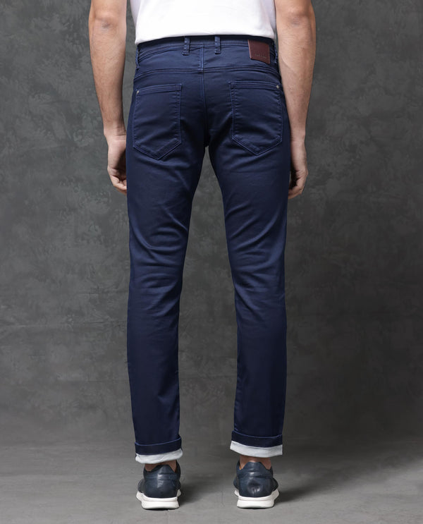 Rare Rabbit Mens Jules Blue Mid Rise Mid Wash Cotton Polyester Solid Slim Fit Jeans