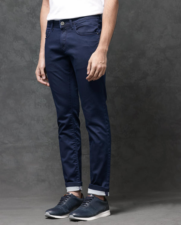 Rare Rabbit Mens Jules Blue Mid Rise Mid Wash Cotton Polyester Solid Slim Fit Jeans