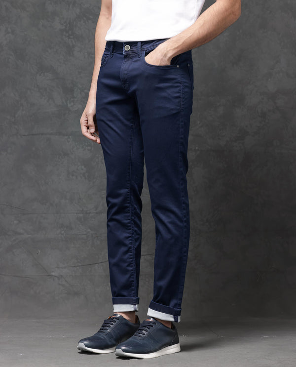 Rare Rabbit Mens Jules Blue Mid Rise Mid Wash Cotton Polyester Solid Slim Fit Jeans