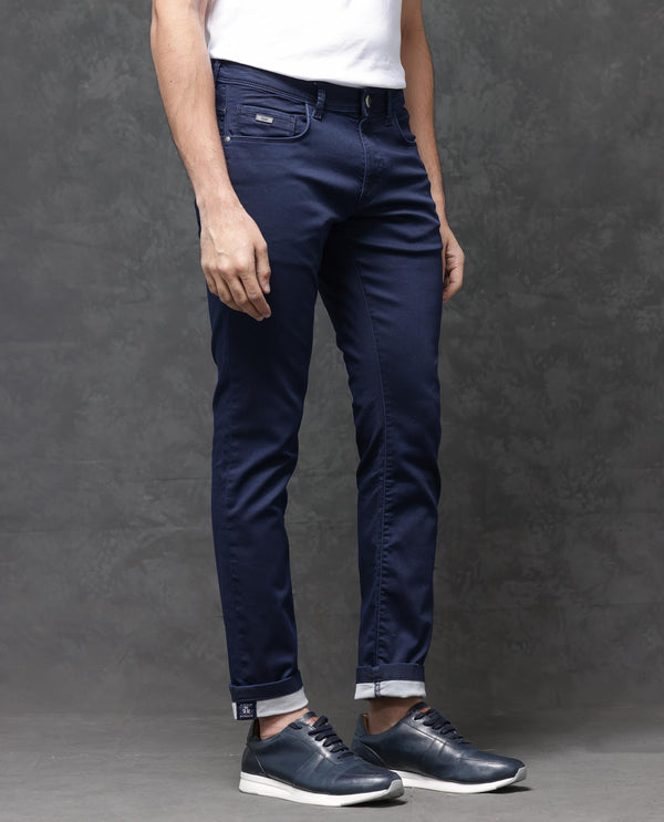 Rare Rabbit Mens Jules Blue Mid Rise Mid Wash Cotton Polyester Solid Slim Fit Jeans