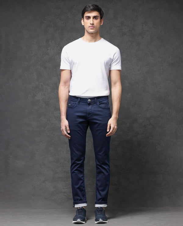 Rare Rabbit Mens Jules Blue Mid Rise Mid Wash Cotton Polyester Solid Slim Fit Jeans
