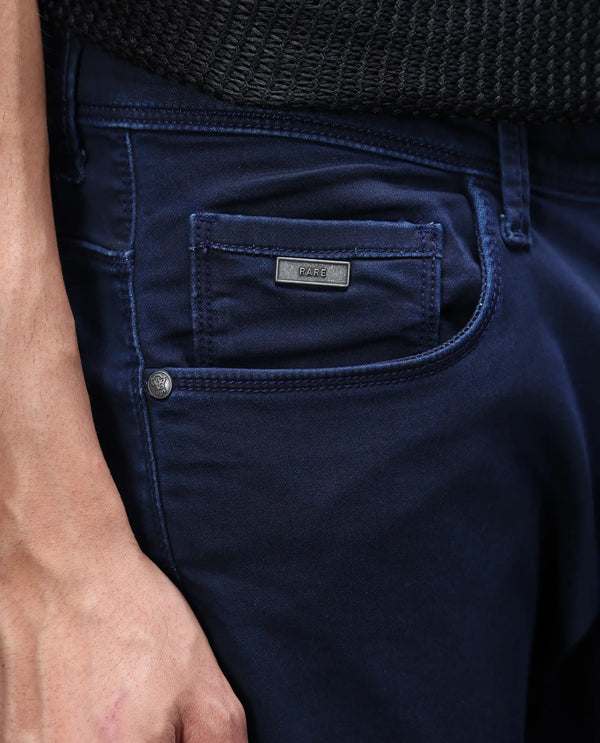 Rare Rabbit Mens Jules Blue Mid Rise Mid Wash Cotton Polyester Solid Slim Fit Jeans
