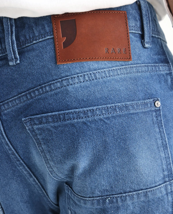 Rare Rabbit Men's Kobet Blue Cotton Fabric Mid Wash Mid Rise Regular Fit Cut and Sew Jeans