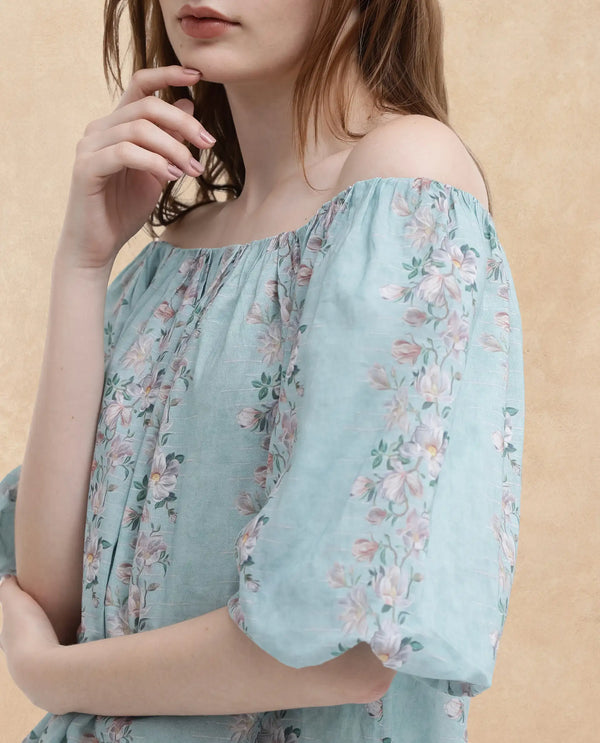 Rareism Women Leyan Dusky Blue Cotton Fabric Balloon Sleeves Boat Neck Tie Up Closure Floral Print Relaxed Fit Top