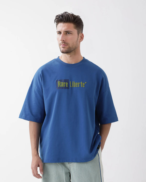 Rare Rabbit Men Moshe Flouroscent Blue Cotton Fabric Short Sleeve Oversized Fit Graphic Printed T-Shirt