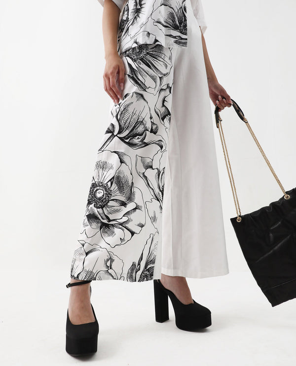 Rareism Women Neilsono White Cotton Satin Fabric Tie-Up Closure Flared Fit Ankle Length Floral Print Trouser