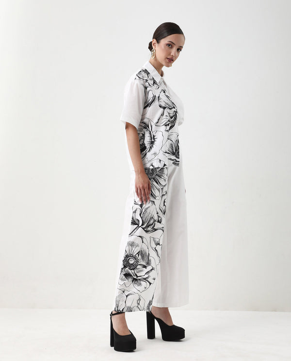 Rareism Women Neilsono White Cotton Satin Fabric Tie-Up Closure Flared Fit Ankle Length Floral Print Trouser