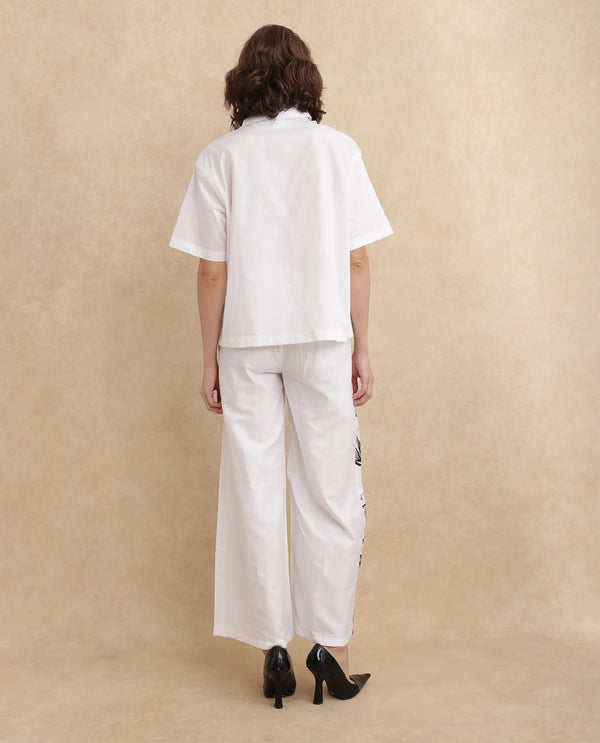 Rareism Women Neilsono White Cotton Satin Fabric Tie-Up Closure Flared Fit Ankle Length Floral Print Trouser