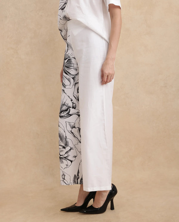 Rareism Women Neilsono White Cotton Satin Fabric Tie-Up Closure Flared Fit Ankle Length Floral Print Trouser
