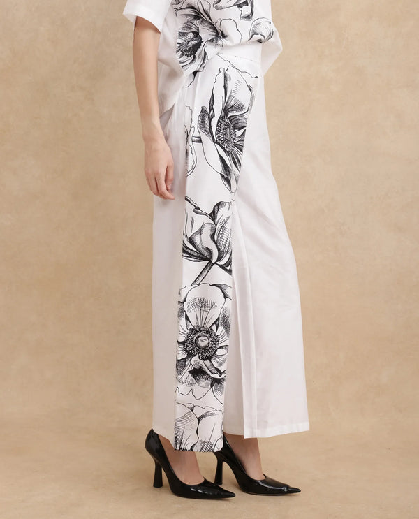 Rareism Women Neilsono White Cotton Satin Fabric Tie-Up Closure Flared Fit Ankle Length Floral Print Trouser