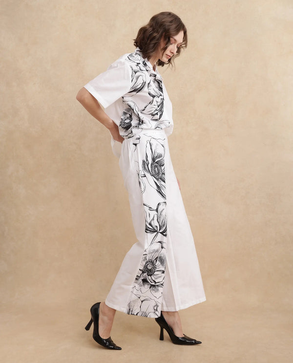 Rareism Women Neilsono White Cotton Satin Fabric Tie-Up Closure Flared Fit Ankle Length Floral Print Trouser