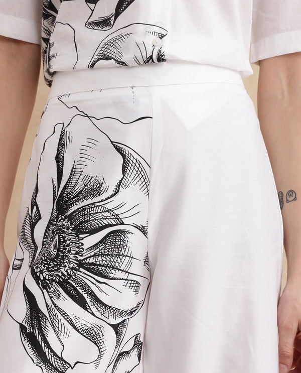 Rareism Women Neilsono White Cotton Satin Fabric Tie-Up Closure Flared Fit Ankle Length Floral Print Trouser