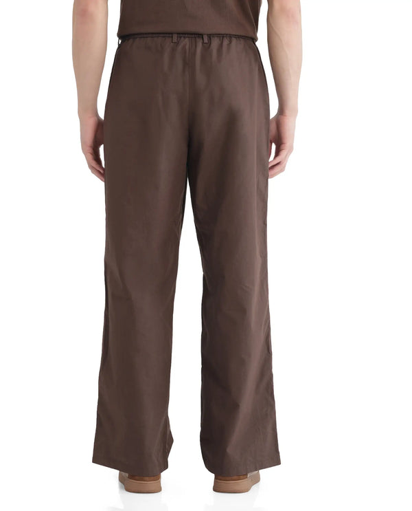 Rare Rabbit Men Newnon Brown Cotton Fabric Mid Rise Baggy Fit Side Slit with Snap Button Closure Tape Detailing Track Pant