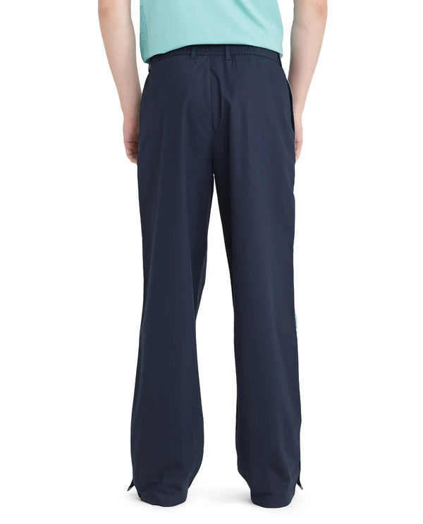 Rare Rabbit Men Newnon Navy Cotton Fabric Mid Rise Baggy Fit Side Slit with Snap Button Closure Tape Detailing Track Pant