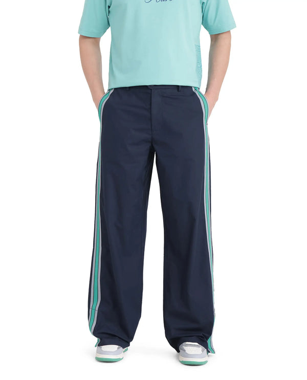 Rare Rabbit Men Newnon Navy Cotton Fabric Mid Rise Baggy Fit Side Slit with Snap Button Closure Tape Detailing Track Pant