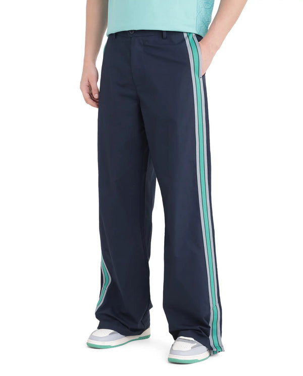Rare Rabbit Men Newnon Navy Cotton Fabric Mid Rise Baggy Fit Side Slit with Snap Button Closure Tape Detailing Track Pant