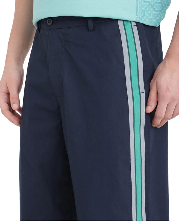 Rare Rabbit Men Newnon Navy Cotton Fabric Mid Rise Baggy Fit Side Slit with Snap Button Closure Tape Detailing Track Pant