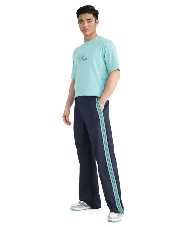 Rare Rabbit Men Newnon Navy Cotton Fabric Mid Rise Baggy Fit Side Slit with Snap Button Closure Tape Detailing Track Pant
