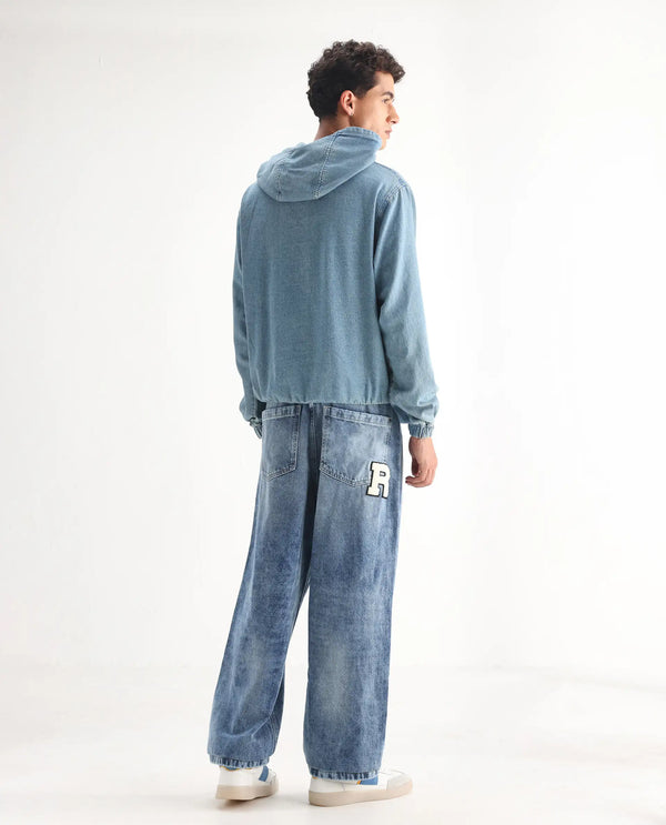 Rare Rabbit Men Riffin Light Blue Cotton Fabric Button And Zip Closure Baggy Fit Embroidered Logo Plain Jeans
