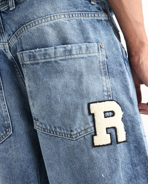 Rare Rabbit Men Riffin Light Blue Cotton Fabric Button And Zip Closure Baggy Fit Embroidered Logo Plain Jeans