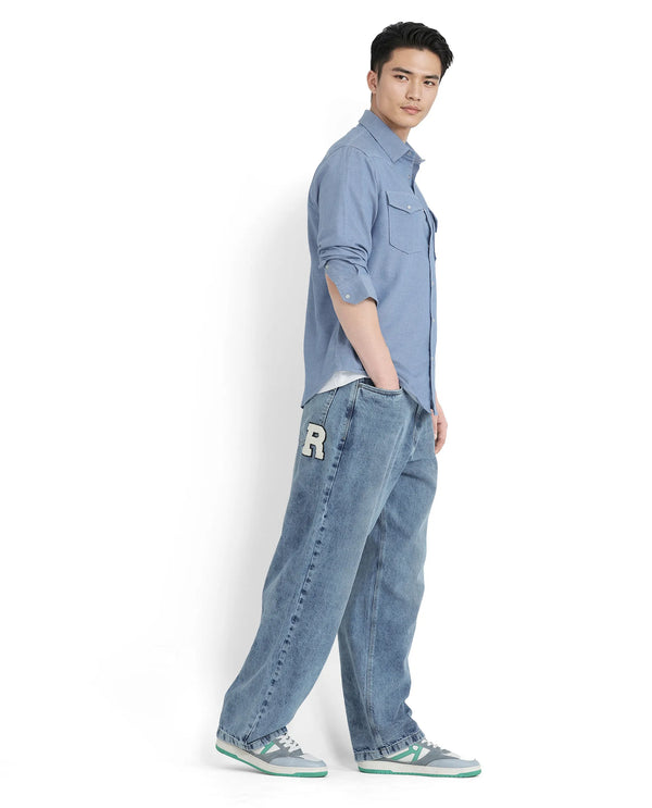 Rare Rabbit Men Riffin Light Blue Cotton Fabric Button And Zip Closure Baggy Fit Embroidered Logo Plain Jeans