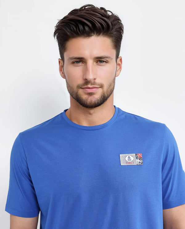 Rare Rabbit Men Saw Pastel Blue Cotton Lycra Fabric Short Sleeve Crew Neck Label Print T-Shirt